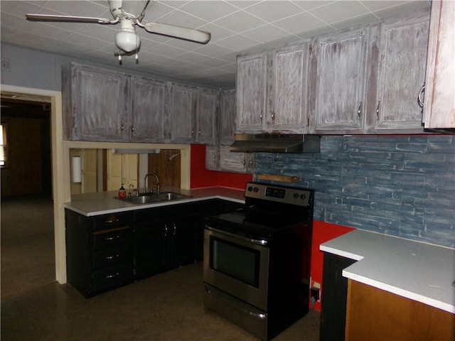 1402 N Kentucky St, Iola, KS 66749 - kitchen featuring electric range, range hood, ceiling fan, and light countertops