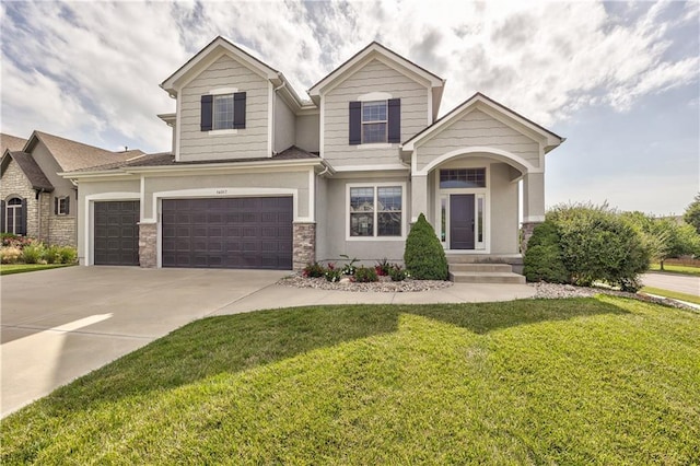 14017 Haskins St, Overland Park, KS 66221 - craftsman-style house with a front yard, concrete driveway, stucco siding, stone siding, and a garage