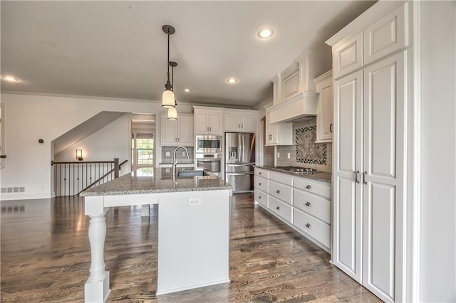 14017 Haskins St, Overland Park, KS 66221 - kitchen with appliances with stainless steel finishes, white cabinets, recessed lighting, dark stone countertops, and dark wood-style floors