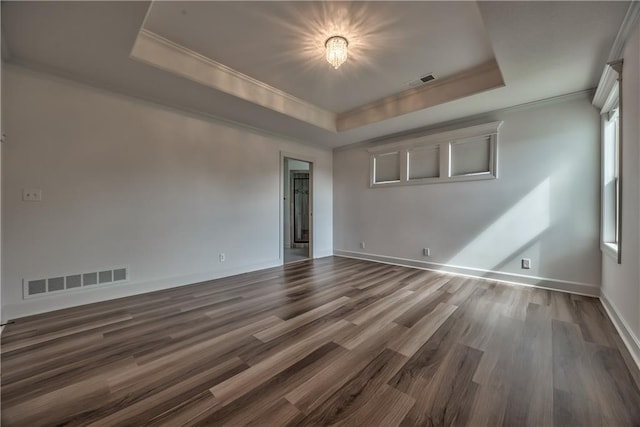 14017 Haskins St, Overland Park, KS 66221 - empty room with a tray ceiling, ornamental molding, and wood finished floors