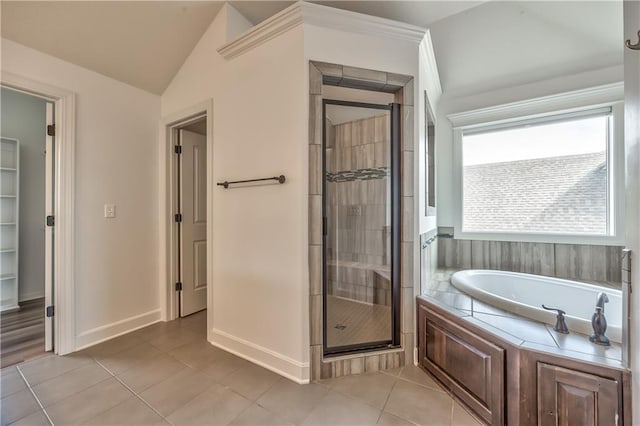 14017 Haskins St, Overland Park, KS 66221 - full bath with a bath, a stall shower, tile patterned floors, and lofted ceiling