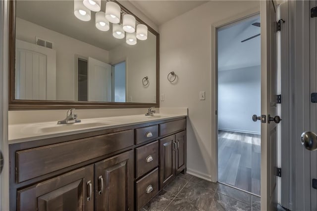 14017 Haskins St, Overland Park, KS 66221 - bathroom featuring double vanity and baseboards