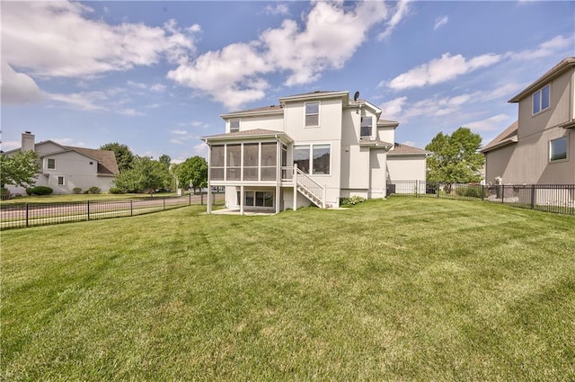 14017 Haskins St, Overland Park, KS 66221 - back of house featuring a sunroom and a fenced backyard