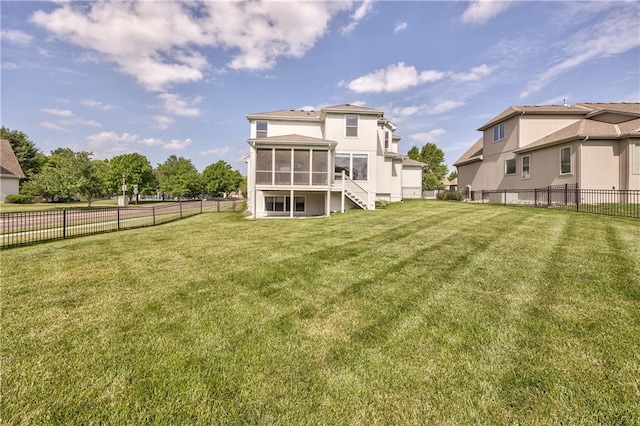 14017 Haskins St, Overland Park, KS 66221 - back of property with a sunroom, a fenced backyard, and stairs