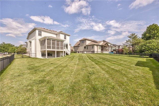 14017 Haskins St, Overland Park, KS 66221 - rear view of house featuring a sunroom, a fenced backyard, and a residential view
