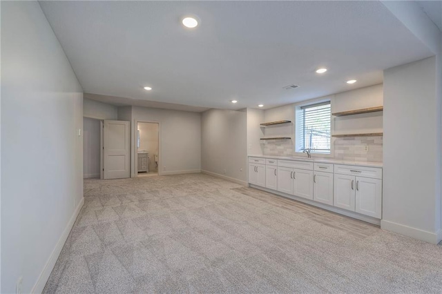 18670 W 248th St, Paola, KS 66071 - unfurnished living room with light carpet and recessed lighting