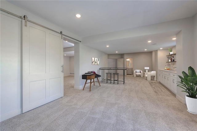 18670 W 248th St, Paola, KS 66071 - below grade area with a barn door, light colored carpet, and recessed lighting