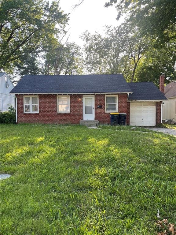 7406 Tracy Ave, Kansas City, MO 64131 - ranch-style house with brick siding, a garage, driveway, and a front yard