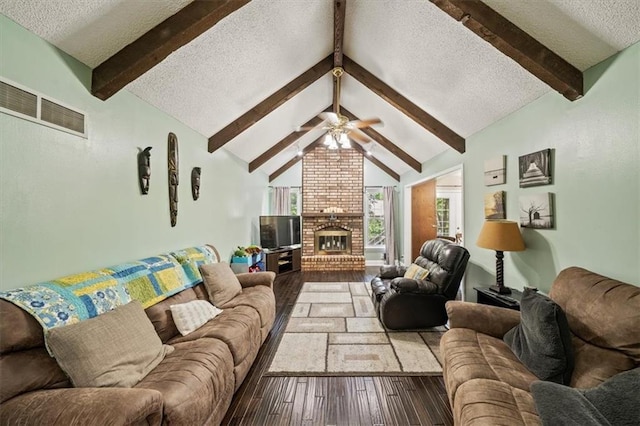 16304 W 126th St, Olathe, KS 66062 - living area featuring a textured ceiling, wood-type flooring, a brick fireplace, and ceiling fan