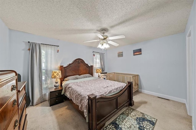 16304 W 126th St, Olathe, KS 66062 - bedroom featuring light colored carpet, a ceiling fan, and a textured ceiling