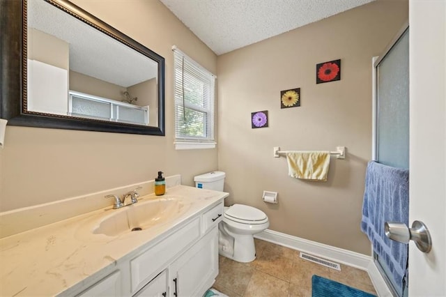 16304 W 126th St, Olathe, KS 66062 - bathroom featuring vanity, a shower with door, a textured ceiling, and tile patterned flooring