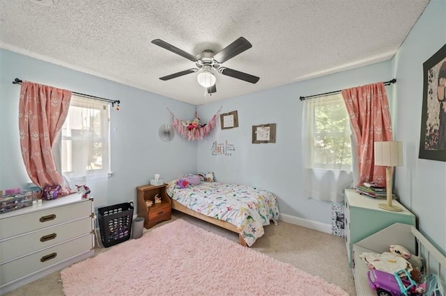 16304 W 126th St, Olathe, KS 66062 - carpeted bedroom with multiple windows, a textured ceiling, and a ceiling fan