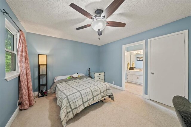 16304 W 126th St, Olathe, KS 66062 - bedroom with carpet flooring, a textured ceiling, ensuite bath, and a ceiling fan