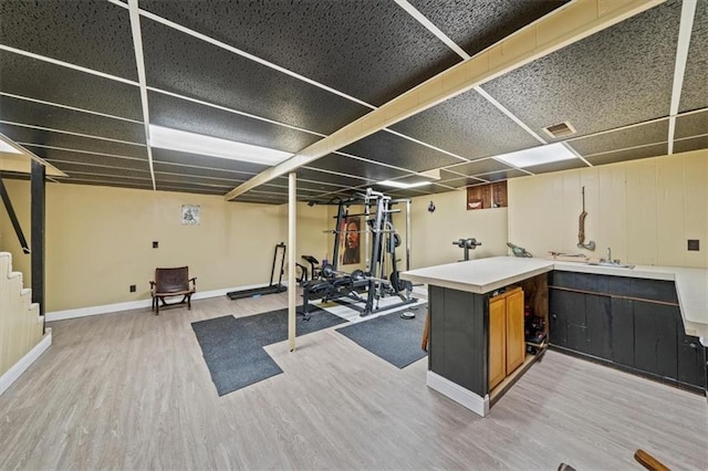 16304 W 126th St, Olathe, KS 66062 - exercise area with wood finished floors and baseboards