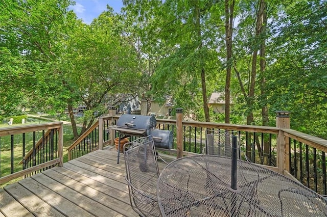 16304 W 126th St, Olathe, KS 66062 - wooden deck with outdoor dining space and a grill