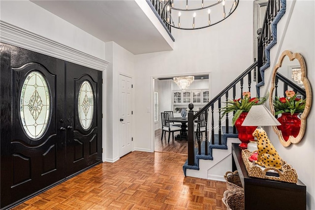 11401 Cedar St, Leawood, KS 66211 - entrance foyer featuring a chandelier, stairs, and french doors