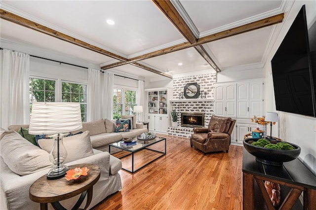 11401 Cedar St, Leawood, KS 66211 - living area with coffered ceiling, light wood finished floors, beamed ceiling, a brick fireplace, and crown molding