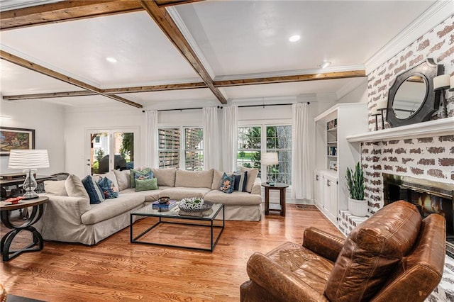 11401 Cedar St, Leawood, KS 66211 - living room featuring wood finished floors, a brick fireplace, ornamental molding, recessed lighting, and beamed ceiling