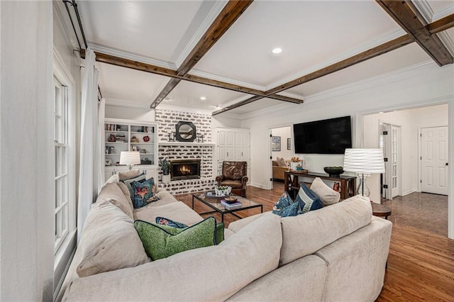 11401 Cedar St, Leawood, KS 66211 - living area with coffered ceiling, beam ceiling, wood finished floors, a brick fireplace, and ornamental molding