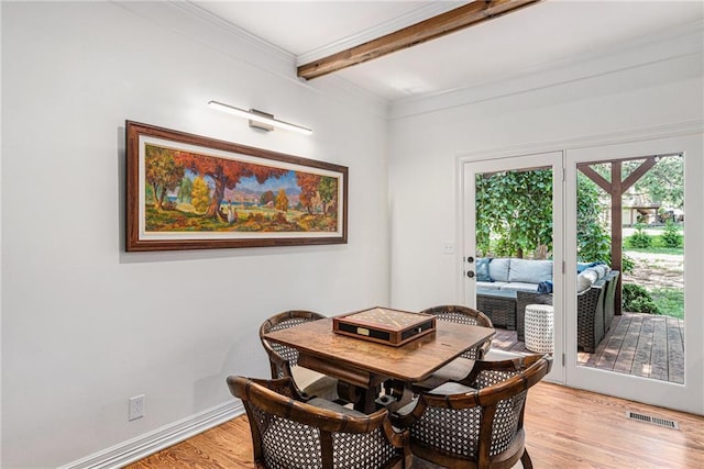11401 Cedar St, Leawood, KS 66211 - dining area with beamed ceiling, light wood-style floors, and crown molding