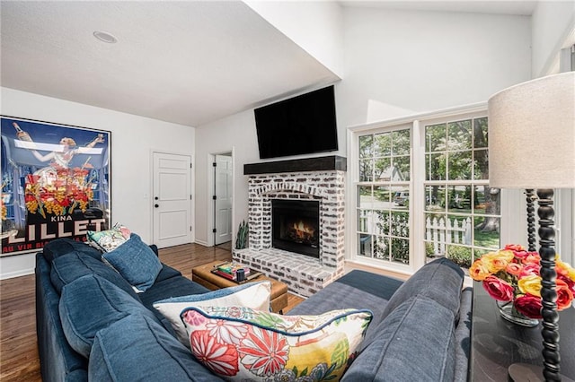11401 Cedar St, Leawood, KS 66211 - living area with wood finished floors and a brick fireplace