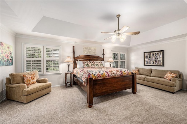 11401 Cedar St, Leawood, KS 66211 - bedroom featuring light colored carpet, multiple windows, a raised ceiling, crown molding, and ceiling fan