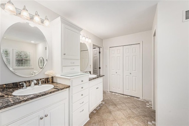 11401 Cedar St, Leawood, KS 66211 - bathroom featuring double vanity and a closet