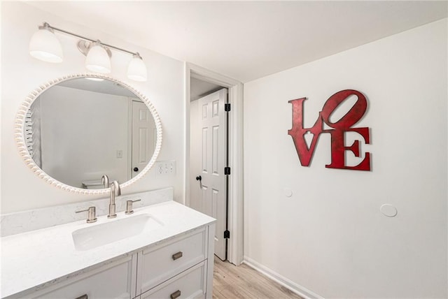 11401 Cedar St, Leawood, KS 66211 - bathroom featuring wood finished floors and vanity