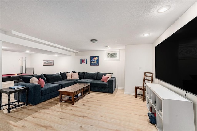 11401 Cedar St, Leawood, KS 66211 - living area with a textured ceiling, light wood-style floors, and recessed lighting