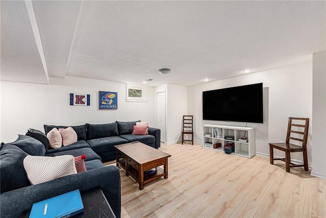 11401 Cedar St, Leawood, KS 66211 - living area featuring light wood-type flooring, recessed lighting, and a textured ceiling