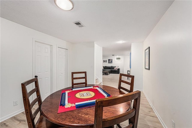 11401 Cedar St, Leawood, KS 66211 - dining space featuring light wood finished floors and baseboards