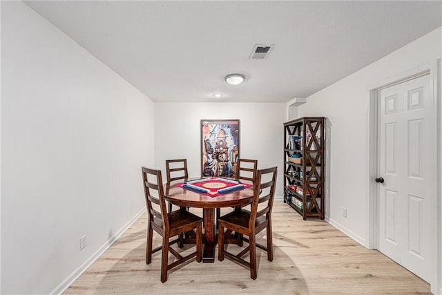 11401 Cedar St, Leawood, KS 66211 - dining room with light wood-style flooring and baseboards