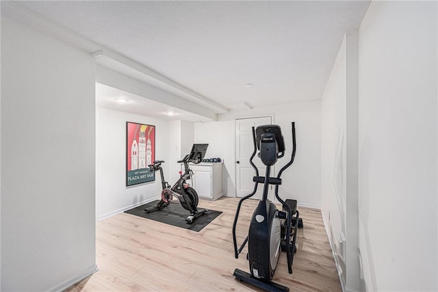 11401 Cedar St, Leawood, KS 66211 - workout room featuring light wood finished floors and baseboards