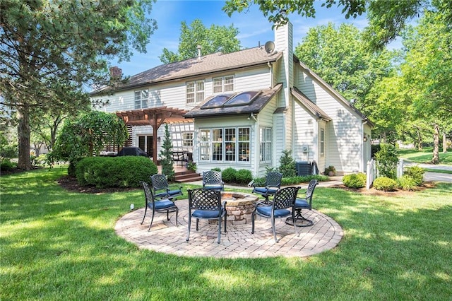 11401 Cedar St, Leawood, KS 66211 - back of house featuring a fire pit, a pergola, a chimney, a lawn, and a patio area