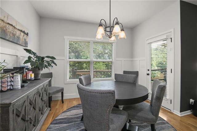 1013 SE Beatty Ct, Blue Springs, MO 64014 - dining room with wood finished floors and a chandelier