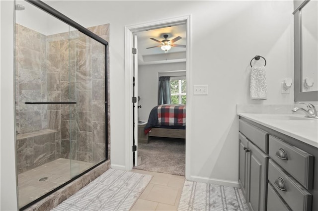 1013 SE Beatty Ct, Blue Springs, MO 64014 - ensuite bathroom with a ceiling fan, vanity, a stall shower, and tile patterned flooring