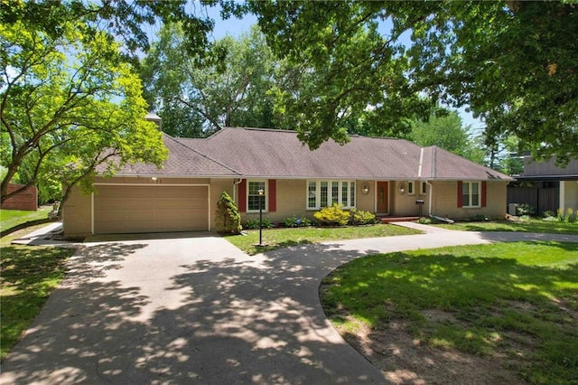 4411 W 89th St, Prairie Village, KS 66207 - single story home featuring driveway, an attached garage, and a front lawn