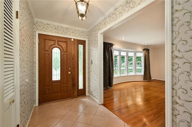 4411 W 89th St, Prairie Village, KS 66207 - entrance foyer featuring ornamental molding, wallpapered walls, and light tile patterned flooring