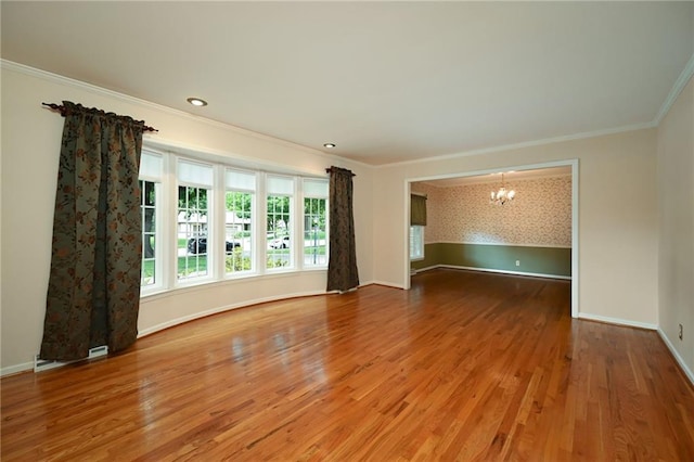 4411 W 89th St, Prairie Village, KS 66207 - unfurnished room with a chandelier, ornamental molding, and wood finished floors