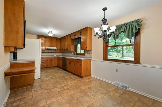4411 W 89th St, Prairie Village, KS 66207 - kitchen with dishwasher, freestanding refrigerator, a chandelier, light countertops, and light stone finish floors