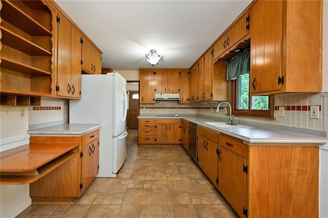4411 W 89th St, Prairie Village, KS 66207 - kitchen with freestanding refrigerator, under cabinet range hood, dishwasher, decorative backsplash, and stone finish flooring