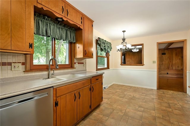 4411 W 89th St, Prairie Village, KS 66207 - kitchen featuring stainless steel dishwasher, tasteful backsplash, and light countertops