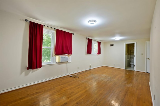4411 W 89th St, Prairie Village, KS 66207 - unfurnished room with cooling unit, wood-type flooring, and healthy amount of natural light