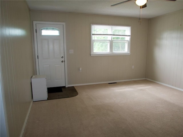 715 N Warren St, Warrensburg, MO 64093 - foyer entrance with a ceiling fan, healthy amount of natural light, and carpet