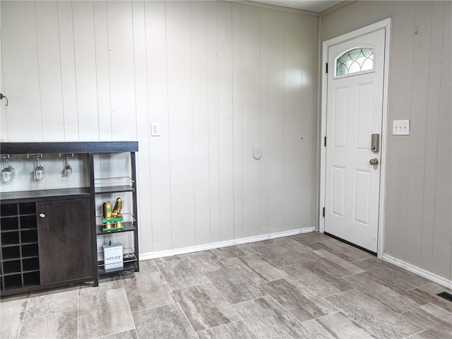 715 N Warren St, Warrensburg, MO 64093 - foyer with wooden walls and stone finish flooring