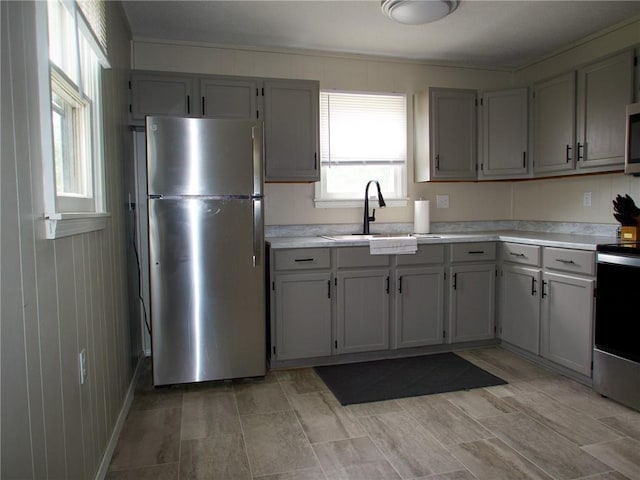 715 N Warren St, Warrensburg, MO 64093 - kitchen with appliances with stainless steel finishes, light countertops, and gray cabinets