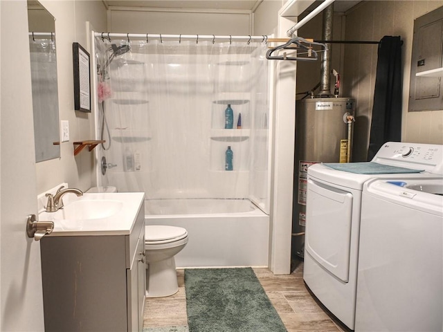 715 N Warren St, Warrensburg, MO 64093 - full bath featuring independent washer and dryer, vanity, wood finished floors, electric panel, and shower / bath combo with shower curtain