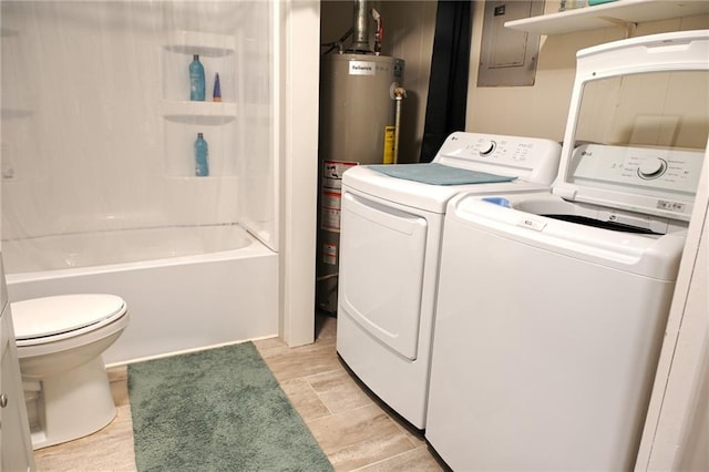 715 N Warren St, Warrensburg, MO 64093 - laundry area featuring washer and dryer, electric panel, and water heater