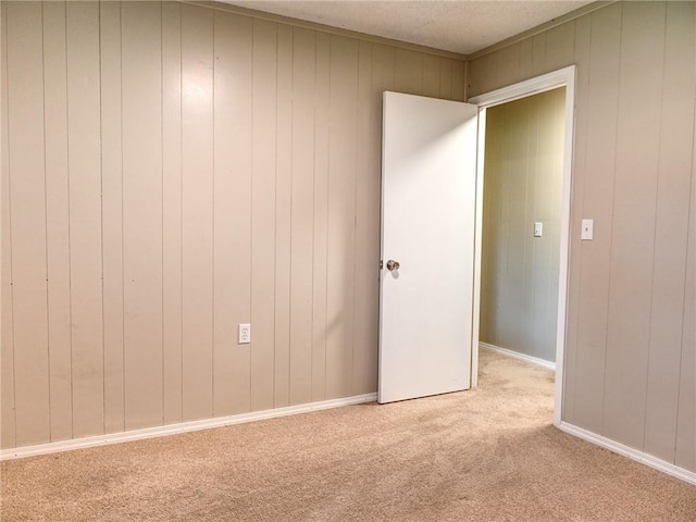 715 N Warren St, Warrensburg, MO 64093 - spare room with light colored carpet and wood walls