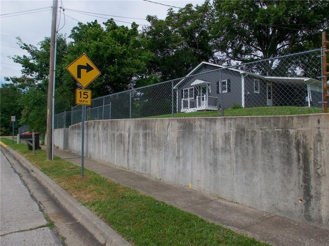 715 N Warren St, Warrensburg, MO 64093 - view of asphalt street with curbs, traffic signs, and sidewalks